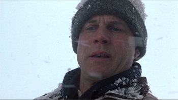 Movie still from “A Simple Plan” (1998), directed by Sam Raimi – A person wearing a jacket and a hat; Close Up shot, Low angle