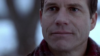 Movie still from “A Simple Plan” (1998), directed by Sam Raimi – A person wearing a scarf; Close Up shot, Over the shoulder angle