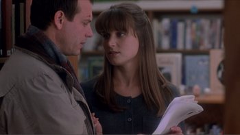 Movie still from “A Simple Plan” (1998), directed by Sam Raimi – A man and a woman looking at a piece of paper; Medium shot, Over the shoulder angle