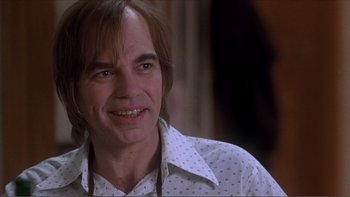 Movie still from “A Simple Plan” (1998), directed by Sam Raimi – A person wearing a white shirt; Close Up shot, Over the shoulder angle