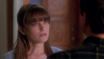 Movie still from “A Simple Plan” (1998), directed by Sam Raimi – A person with long brown hair; Close Up shot, Over the shoulder angle