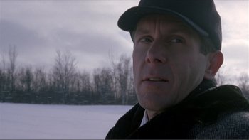 Movie still from “A Simple Plan” (1998), directed by Sam Raimi – A person wearing a hat; Close Up shot, Low angle