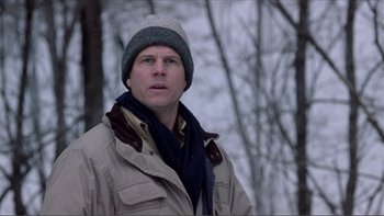 Movie still from “A Simple Plan” (1998), directed by Sam Raimi – A man wearing a jacket and a hat standing in the snow; Close Up shot, Low angle