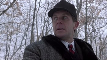 Movie still from “A Simple Plan” (1998), directed by Sam Raimi – A man wearing a hat and a jacket; Close Up shot, Low angle