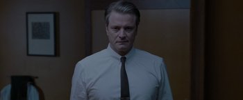 Movie still from “A Single Man” (2009), directed by Tom Ford – A person wearing a shirt and a tie; Medium shot, Low angle