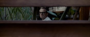Movie still from “A Single Man” (2009), directed by Tom Ford – A man looking at himself in a mirror; Medium shot, Over the shoulder angle