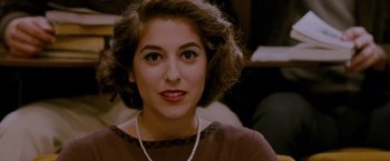 Movie still from “A Single Man” (2009), directed by Tom Ford – A person wearing a necklace; Close Up shot, High angle