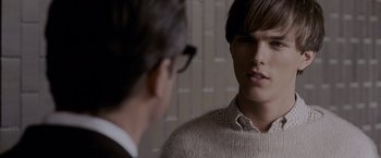 Movie still from “A Single Man” (2009), directed by Tom Ford – A man in a sweater talking to another man in a suit; Close Up shot, Over the shoulder angle