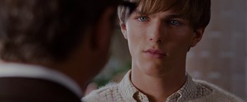Movie still from “A Single Man” (2009), directed by Tom Ford – A person looking at a mirror; Close Up shot, Over the shoulder angle