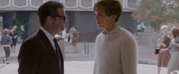 Movie still from “A Single Man” (2009), directed by Tom Ford – A man and a boy are standing next to each other; Medium shot, Over the shoulder angle