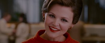 Movie still from “A Single Man” (2009), directed by Tom Ford – A person wearing a red sweater; Close Up shot, Over the shoulder angle