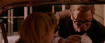 Movie still from “A Single Man” (2009), directed by Tom Ford – A man and a woman in the back seat of a car; Medium shot, Over the shoulder angle