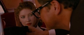 Movie still from “A Single Man” (2009), directed by Tom Ford – A man and a woman looking into a mirror; Close Up shot, Over the shoulder angle