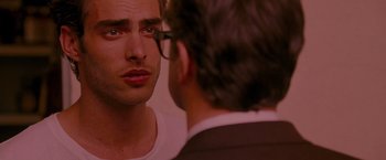 Movie still from “A Single Man” (2009), directed by Tom Ford – A person looking in a mirror; Close Up shot, Over the shoulder angle