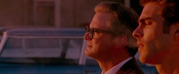 Movie still from “A Single Man” (2009), directed by Tom Ford – A person wearing glasses; Close Up shot, Low angle