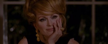 Movie still from “A Single Man” (2009), directed by Tom Ford – A person wearing a black shirt; Close Up shot, Over the shoulder angle