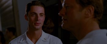 Movie still from “A Single Man” (2009), directed by Tom Ford – A man and a woman talking to each other; Close Up shot, Over the shoulder angle