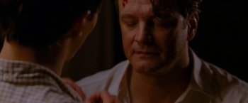 Movie still from “A Single Man” (2009), directed by Tom Ford – A man with a bandage on his head is looking down at another man; Close Up shot, Over the shoulder angle