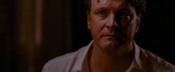 Movie still from “A Single Man” (2009), directed by Tom Ford – A person with a bandage on his head; Close Up shot, Over the shoulder angle