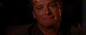 Movie still from “A Single Man” (2009), directed by Tom Ford – A person with a bandage on his head; Close Up shot, Over the shoulder angle