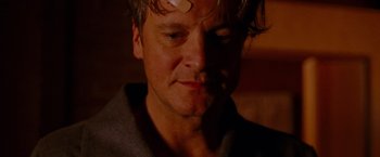 Movie still from “A Single Man” (2009), directed by Tom Ford – A person with a bandage on his head; Close Up shot, Low angle