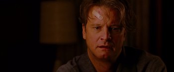 Movie still from “A Single Man” (2009), directed by Tom Ford – A person with bandage on his head; Close Up shot, Low angle