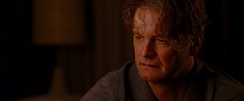 Movie still from “A Single Man” (2009), directed by Tom Ford – A person looking at the camera; Close Up shot, Over the shoulder angle