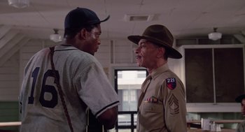 Movie still from “A Soldier's Story” (1984), directed by Norman Jewison – A couple of men standing next to each other; Medium shot, Over the shoulder angle