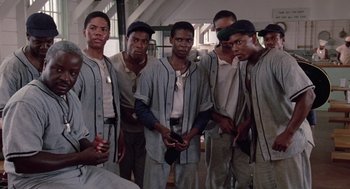Movie still from “A Soldier's Story” (1984), directed by Norman Jewison – A group of young men standing next to each other; Medium shot, Low angle