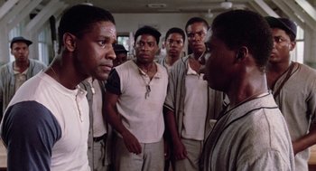 Movie still from “A Soldier's Story” (1984), directed by Norman Jewison – A group of men standing next to each other in a room; Close Up shot, Over the shoulder angle