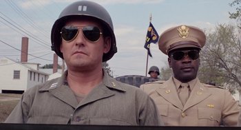 Movie still from “A Soldier's Story” (1984), directed by Norman Jewison – Two men in military uniforms are standing next to each other; Close Up shot, Low angle