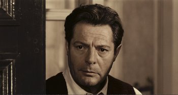 Movie still from “A Special Day” (1977), directed by Ettore Scola – An older man in a white shirt and a brown vest; Close Up shot, Low angle