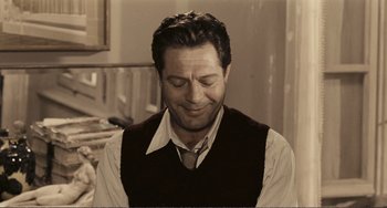 Movie still from “A Special Day” (1977), directed by Ettore Scola – A person wearing a vest and a tie; Close Up shot, Over the shoulder angle