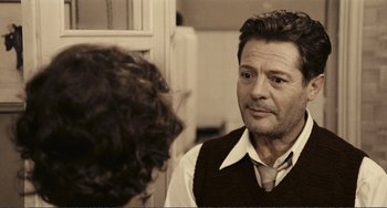 Movie still from “A Special Day” (1977), directed by Ettore Scola – A man looking at himself in the mirror; Close Up shot, Over the shoulder angle