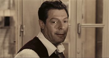 Movie still from “A Special Day” (1977), directed by Ettore Scola – A person wearing a tie; Close Up shot, Over the shoulder angle