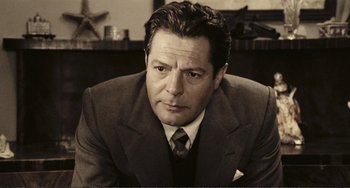 Movie still from “A Special Day” (1977), directed by Ettore Scola – A black and white photo of a man wearing a suit and tie; Close Up shot, Low angle