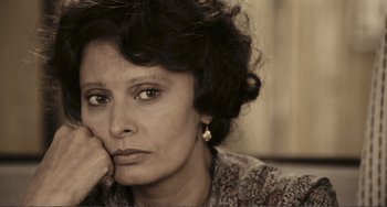 Movie still from “A Special Day” (1977), directed by Ettore Scola – An older woman sitting in front of a window; Close Up shot, High angle