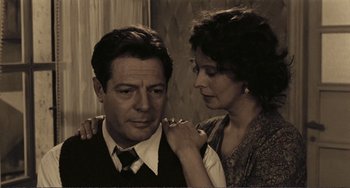 Movie still from “A Special Day” (1977), directed by Ettore Scola – A man and a woman standing next to each other; Close Up shot, Low angle