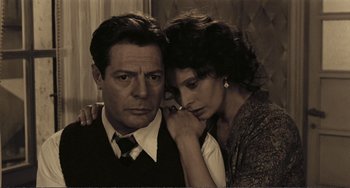 Movie still from “A Special Day” (1977), directed by Ettore Scola – A man and a woman standing next to each other; Close Up shot, High angle