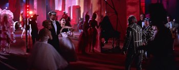 Movie still from “A Star Is Born” (1954), directed by George Cukor – A group of people dancing in a room; Wide shot, Low angle