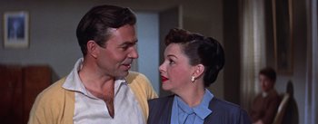 Movie still from “A Star Is Born” (1954), directed by George Cukor – A man and a woman standing next to each other; Close Up shot, Low angle