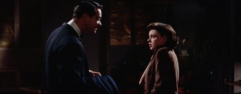 Movie still from “A Star Is Born” (1954), directed by George Cukor – A man and a woman talking to each other; Medium shot, Over the shoulder angle