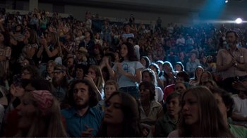 Movie still from “A Star Is Born” (1976), directed by Frank Pierson – A crowd of people in an auditorium watching a show; Wide shot, High angle