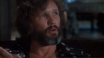 Movie still from “A Star Is Born” (1976), directed by Frank Pierson – A person with a beard; Close Up shot, Low angle