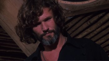 Movie still from “A Star Is Born” (1976), directed by Frank Pierson – A person with long hair and a beard; Close Up shot, Low angle