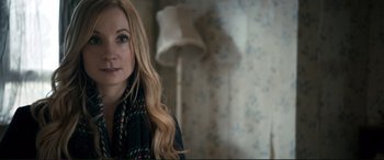 Movie still from “A Street Cat Named Bob” (2016), directed by Roger Spottiswoode – A woman with long blonde hair wearing a scarf; Close Up shot, Over the shoulder angle