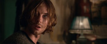 Movie still from “A Street Cat Named Bob” (2016), directed by Roger Spottiswoode – A person with long brown hair; Close Up shot, Over the shoulder angle