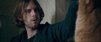 Movie still from “A Street Cat Named Bob” (2016), directed by Roger Spottiswoode – A person with long brown hair; Close Up shot, Over the shoulder angle