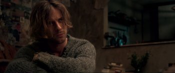 Movie still from “A Street Cat Named Bob” (2016), directed by Roger Spottiswoode – A person with long hair; Close Up shot, Over the shoulder angle