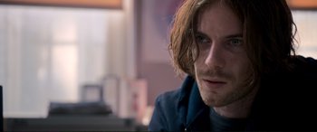 Movie still from “A Street Cat Named Bob” (2016), directed by Roger Spottiswoode – A person with long brown hair; Close Up shot, Over the shoulder angle